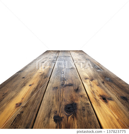 Rustic wooden table with weathered surface extends into distance, showcasing its natural grain and texture. warm tones and knots add character to wood 137823775