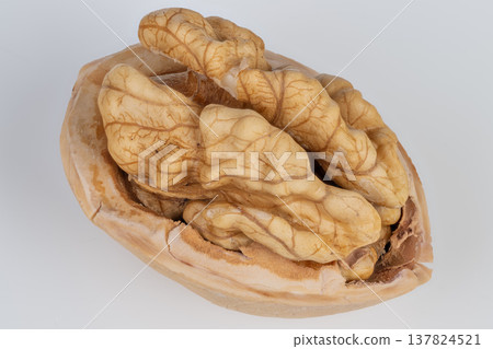 Walnut halves show nutritional benefits. Rich walnut pieces emphasize healthpromoting nutrients and fats. Walnut core reduces heart disease risk through healthy oils and proteins Walnut halves show nutritional benefits. Rich walnut pieces emphasize healthpromoting nutrients and fats. Walnut core reduces heart disease risk through healthy oils and proteins 137824521