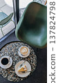 Coffee and cheesecake on terrazzo table in cozy cafe 137824798