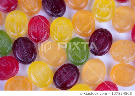Multicolored candies arranged in minimalist composition with clean white negative space, balanced color placement and modern graphic look, ideal for editorial and social posts Multicolored candies arranged in minimalist composition with clean white negative space, balanced color placement and modern graphic look, ideal for editorial and social posts 137824868