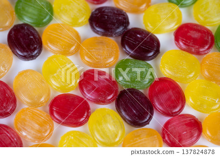 Vivid multicolored treats evoke tropical vibrancy. Variety of brightly hued confections highlight summer themes and reflective surfaces for marketing and decorating Vivid multicolored treats evoke tropical vibrancy. Variety of brightly hued confections highlight summer themes and reflective surfaces for marketing and decorating 137824878