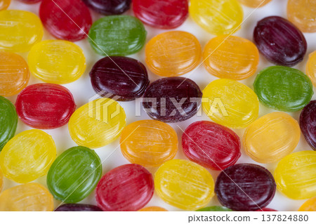 Examination of colorful candy surfaces. Comprehensive study capturing surface textures and color differences in assorted multicolored sweets for scientific documentation Examination of colorful candy surfaces. Comprehensive study capturing surface textures and color differences in assorted multicolored sweets for scientific documentation 137824880