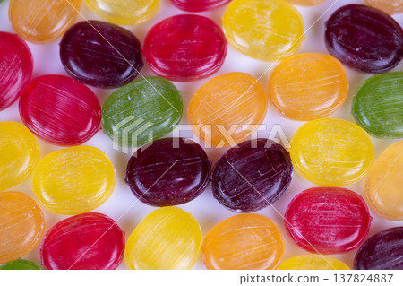 Multihued confectionery images highlight bulk retail and packaging strategies. Vibrant assorted candies depict presentation concepts for largescale selling and product display 137824887