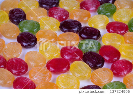 Premium confection photography emphasizing vibrant colors and fine details. Artistic macro image capturing intricate surface and luminous shine of gourmet candy classifications Premium confection photography emphasizing vibrant colors and fine details. Artistic macro image capturing intricate surface and luminous shine of gourmet candy classifications 137824906