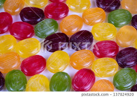 Multicolor confectionery container enhances party and celebration ambiance. Vibrant candyfilled dish complements festive table setup and elevates cheerful celebration mood Multicolor confectionery container enhances party and celebration ambiance. Vibrant candyfilled dish complements festive table setup and elevates cheerful celebration mood 137824920