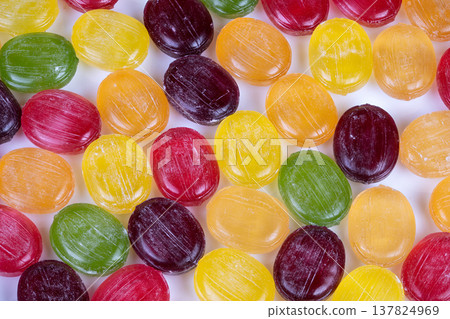 Vivid candies with detailed themes. Colorful sweets study showcasing texture and design. Multicolored confectionery examination focusing on palette and texture comparisons 137824969