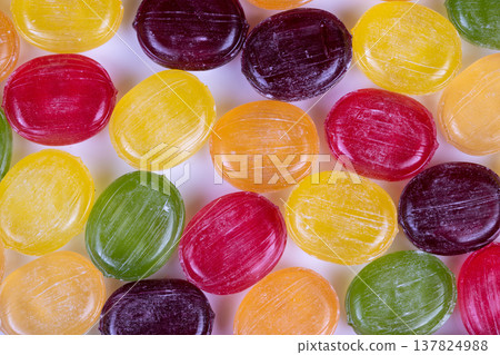 Colorful sweets design. Bright multihued candy pattern for packaging. Repetitive vibrant candy texture with uniform lighting suitable for product presentation Colorful sweets design. Bright multihued candy pattern for packaging. Repetitive vibrant candy texture with uniform lighting suitable for product presentation 137824988