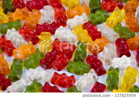 Multicolored gummy bears closeup for product marketing, crisp surface detail and highresolution texture study, perfect for ecommerce imagery and commercial listings Multicolored gummy bears closeup for product marketing, crisp surface detail and highresolution texture study, perfect for ecommerce imagery and commercial listings 137825059