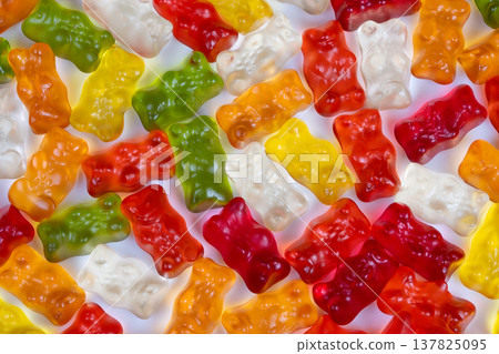 Candy display visuals. Confection packaging presentation with colorful gummy bear displays. Studio setup featuring vibrant gummy bears for packaging and promotional imagery Candy display visuals. Confection packaging presentation with colorful gummy bear displays. Studio setup featuring vibrant gummy bears for packaging and promotional imagery 137825095
