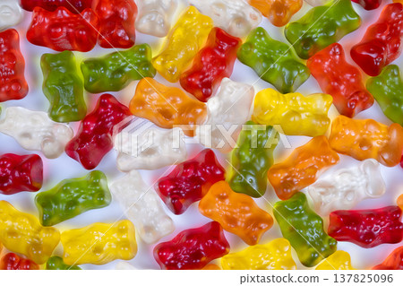 Vibrant treats create lively scene. Cheerful gummies shower lively celebration atmosphere. Bright gummy figures scattered like confetti evoke joyful festival mood Vibrant treats create lively scene. Cheerful gummies shower lively celebration atmosphere. Bright gummy figures scattered like confetti evoke joyful festival mood 137825096