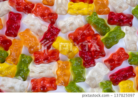 Gummy bears detailed. Closeup of glossy gummy bears. Magnified view reveals jellylike gummy surface. Transparent gummy bears with air bubbles and shiny highlights detailed Gummy bears detailed. Closeup of glossy gummy bears. Magnified view reveals jellylike gummy surface. Transparent gummy bears with air bubbles and shiny highlights detailed 137825097