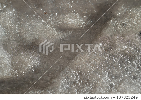 Sun warms ice. Reflections dance on melting snow and icy surfaces carefully. Bright sunlight causes ice to melt and creates beautiful sparkling reflections everywhere Sun warms ice. Reflections dance on melting snow and icy surfaces carefully. Bright sunlight causes ice to melt and creates beautiful sparkling reflections everywhere 137825249