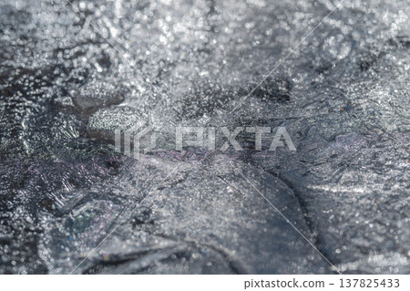 Macro view reveals intricate ice crystal formations and designs. Highly magnified image captures complex ice crystal architectures with stunning star and silver shapes Macro view reveals intricate ice crystal formations and designs. Highly magnified image captures complex ice crystal architectures with stunning star and silver shapes 137825433