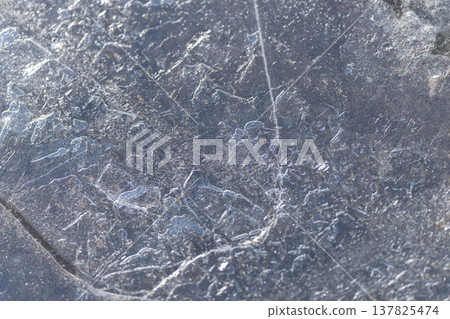 Glittering icy designs. Refined ice with detailed textures. Polished ice displaying complex maplike patterns. Sparkling frost with delicate scratches and subtle bubble formations Glittering icy designs. Refined ice with detailed textures. Polished ice displaying complex maplike patterns. Sparkling frost with delicate scratches and subtle bubble formations 137825474