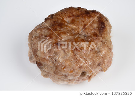 Searred meat patty presentation. Healthy protein portion for morning meal. Nutritious proteinrich cutlet arranged attractively on plain background for fitness imagery 137825530