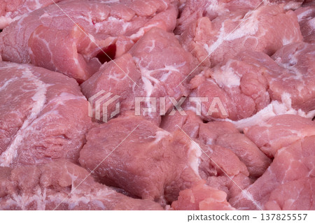 Raw seasoned pork. Prepared raw pork chunks seasoned for culinary preparations. Freshly prepared uncooked pork pieces seasoned thoroughly in readiness for cooking tasks Raw seasoned pork. Prepared raw pork chunks seasoned for culinary preparations. Freshly prepared uncooked pork pieces seasoned thoroughly in readiness for cooking tasks 137825557