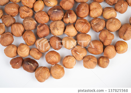 PlantBased Hazelnut Snack Photo. Delicious Plant Based Hazelnut Snack Captured in Lively Photo. Tasty Vegan Nut Treats Documented in Energetic and Vivid Food Photograph 137825568
