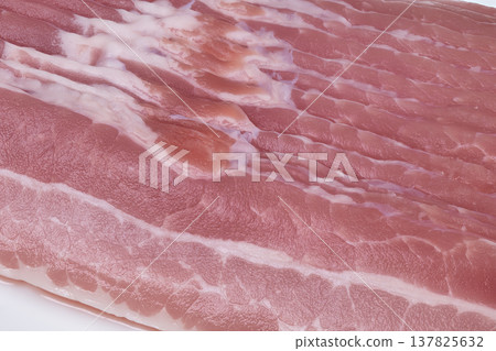 Closeup of bacon. Detailed view of meat marbling. Extreme focus on bacon edge textures and coloration. Close examination of bacon fat rim with intricate marbling and hues Closeup of bacon. Detailed view of meat marbling. Extreme focus on bacon edge textures and coloration. Close examination of bacon fat rim with intricate marbling and hues 137825632