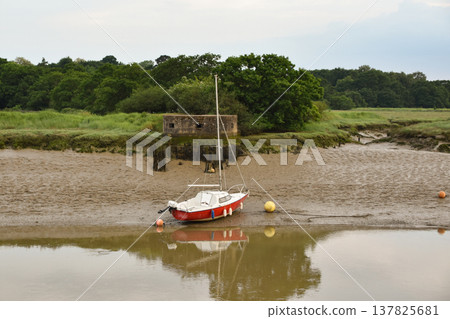 A Boat in the Mud on the River Colne in Essex 137825681