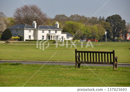 A bench overlooking Great Bentley Village Green in Essex A bench overlooking Great Bentley Village Green in Essex 137825693