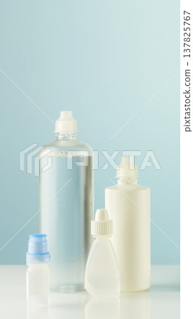 Minimal Cosmetic Bottle Set In Soft Blue Tones On Clean Background Minimal Cosmetic Bottle Set In Soft Blue Tones On Clean Background 137825767