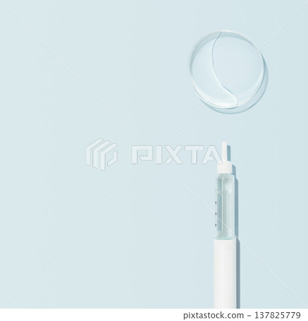 GLP 1 injection pen with clear petri dish on soft blue background and copy space GLP 1 injection pen with clear petri dish on soft blue background and copy space 137825779