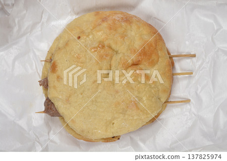 Grilled sis cevapi meat skewers in a lepinja flatbread Grilled sis cevapi meat skewers in a lepinja flatbread 137825974