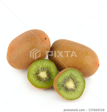 Close-up of sliced and whole kiwi fruits with vibrant green flesh and black seeds isolated on white. High-quality healthy food ingredient for nutritious breakfast and vegetarian snacks. Close-up of sliced and whole kiwi fruits with vibrant green flesh and black seeds isolated on white. High-quality healthy food ingredient for nutritious breakfast and vegetarian snacks. 137826558