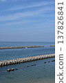 Stone breakwaters and seawalls along the coastal road and the blue sky 137826841