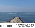 Aquaculture rafts and a protruding stone breakwater 137826842