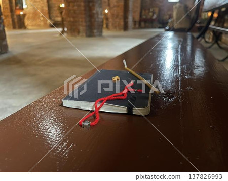 new testament with other church objects on the bench in church new testament with other church objects on the bench in church 137826993