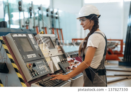 Woman is in the window making factory 137827330