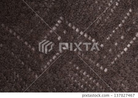 Natural hand-knitted wool shawl close-up 137827467