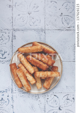 fried spring rolls with cheese, on a plate, with cream sauce, no people, 137828115