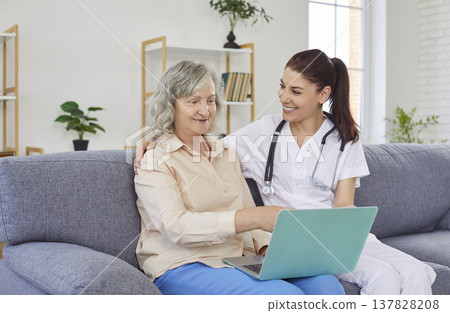 Senior woman in nursing home sitting with laptop, close-up Senior woman in nursing home sitting with laptop, close-up 137828208