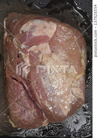 Close up of raw seasoned pork meat with rosemary 137828554