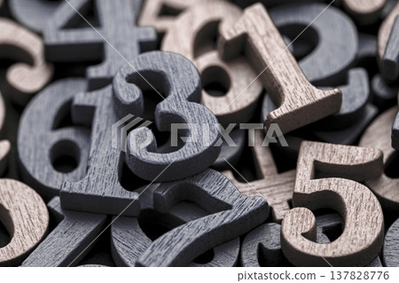 Pile of old wooden numbers in vintage style. Mathematics, education and learning concept. Pile of old wooden numbers in vintage style. Mathematics, education and learning concept. 137828776