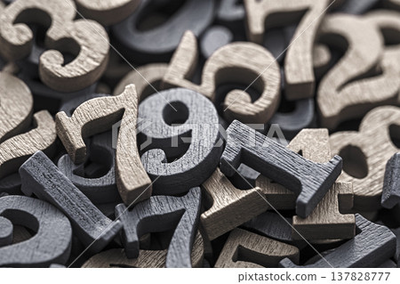 Pile of old wooden numbers in vintage style. Mathematics, education and learning concept. Pile of old wooden numbers in vintage style. Mathematics, education and learning concept. 137828777