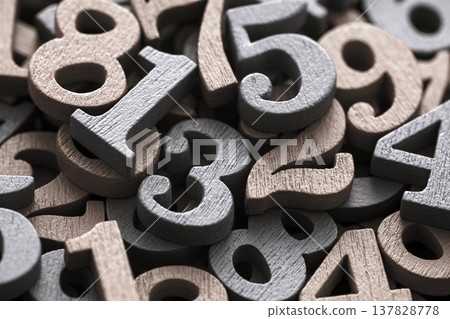 Pile of old wooden numbers in vintage style. Mathematics, education and learning concept. Pile of old wooden numbers in vintage style. Mathematics, education and learning concept. 137828778