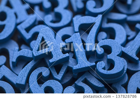 Pile of blue painted wooden numbers in vintage style. Mathematics, education and learning concept. Pile of blue painted wooden numbers in vintage style. Mathematics, education and learning concept. 137828786