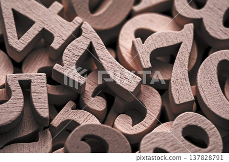 Pile of old wooden numbers in vintage style. Mathematics, education and learning concept. Pile of old wooden numbers in vintage style. Mathematics, education and learning concept. 137828791