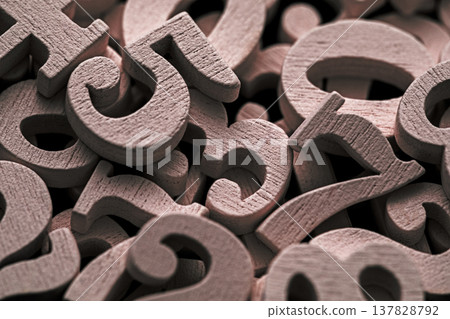 Pile of old wooden numbers in vintage style. Mathematics, education and learning concept. Pile of old wooden numbers in vintage style. Mathematics, education and learning concept. 137828792