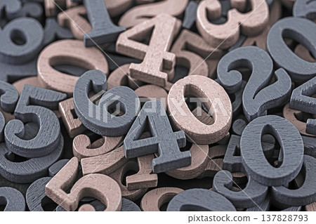 Pile of old wooden numbers in vintage style. Mathematics, education and learning concept. Pile of old wooden numbers in vintage style. Mathematics, education and learning concept. 137828793