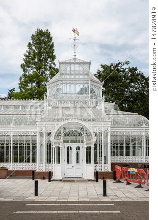 Serving as a centerpiece for the Horniman Museum, the Victorian Conservatory is an ornate masterpiece of iron and glass. Characterized by intricate white latticework and a soaring, light-filled 137828919