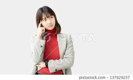 A woman thinking/businesswoman A woman thinking/businesswoman 137829257
