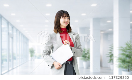 Woman with a laptop / business woman Woman with a laptop / business woman 137829260