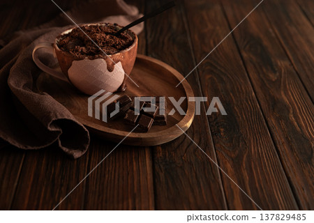 Chocolate mug cake on dark wooden table.Easy homemade dessert. Mugcake from microwave Chocolate mug cake on dark wooden table.Easy homemade dessert. Mugcake from microwave 137829485