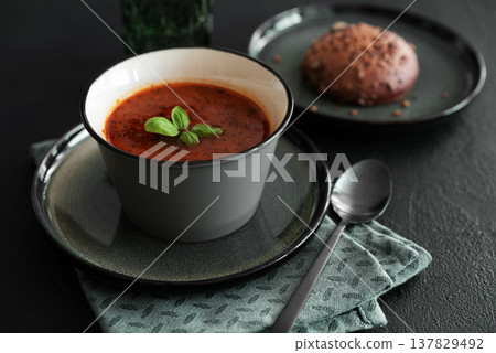 Bowl of homemade red bean soup on dark wooden table. Front view 137829492