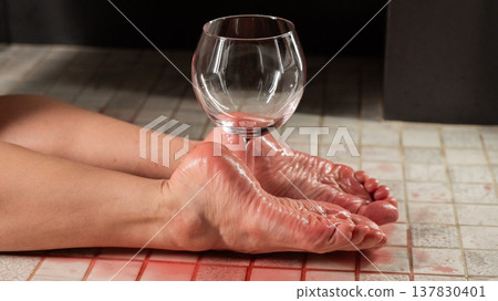 Foot fetish. A woman holds a wine glass in the shower. 137830401