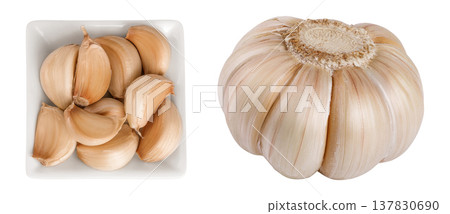 garlic cloves in ceramic bowl isolated on white background close up. Top view. Flat lay. garlic cloves in ceramic bowl isolated on white background close up. Top view. Flat lay. 137830690
